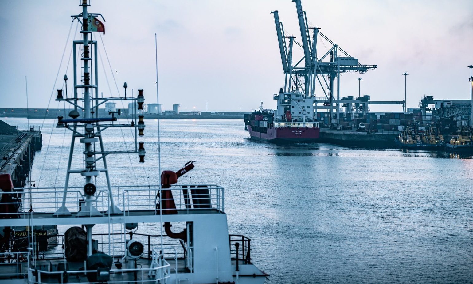 red and white ship on sea during daytime