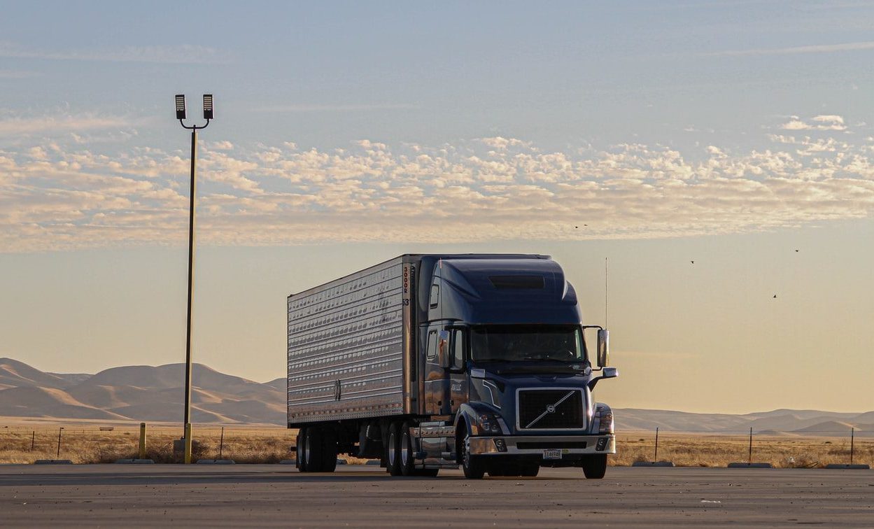 black truck on road during daytime